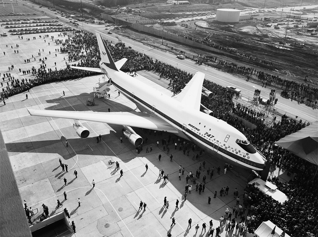The first Boeing 747 on the tarmac surrounded by thousands of onlookers