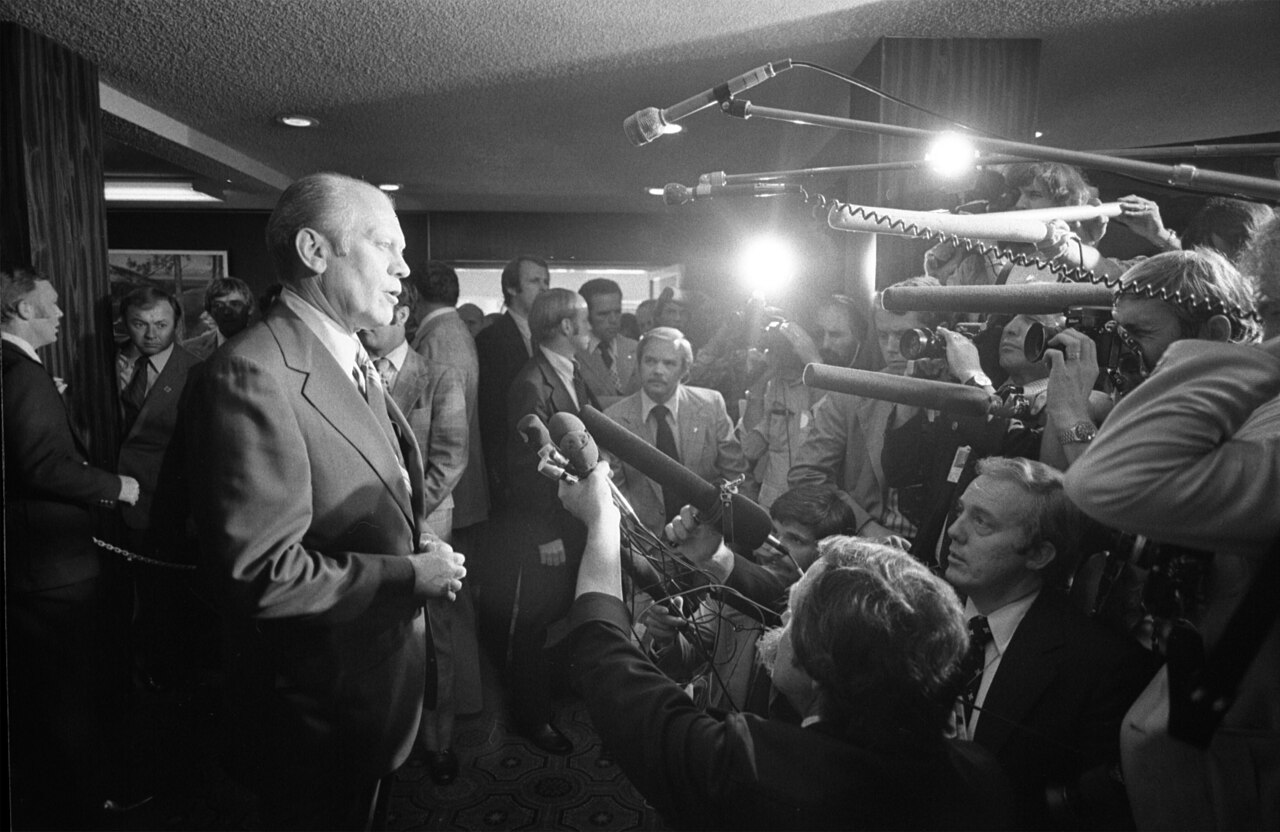 President Ford addresses reporters moments after the assassination attempt
