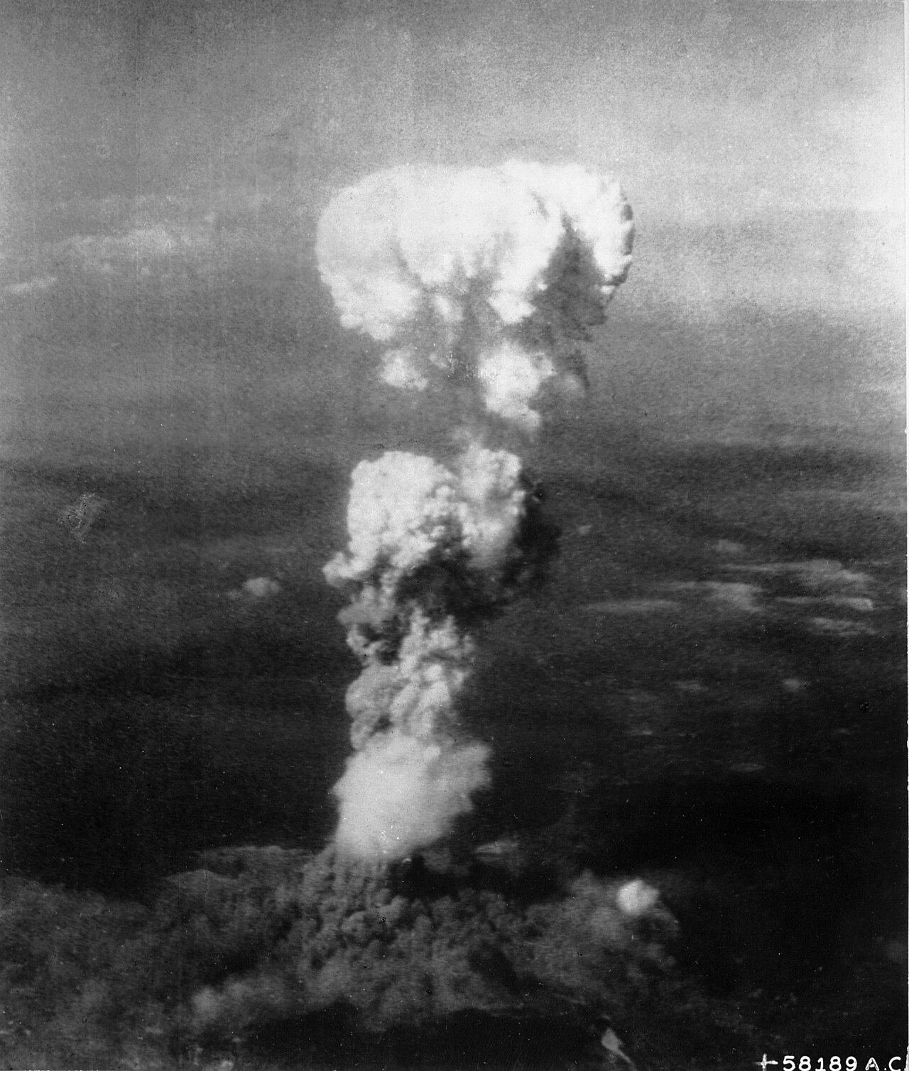 The atomic mushroom cloud rises over Hiroshima following the 1945 United States nuclear attack