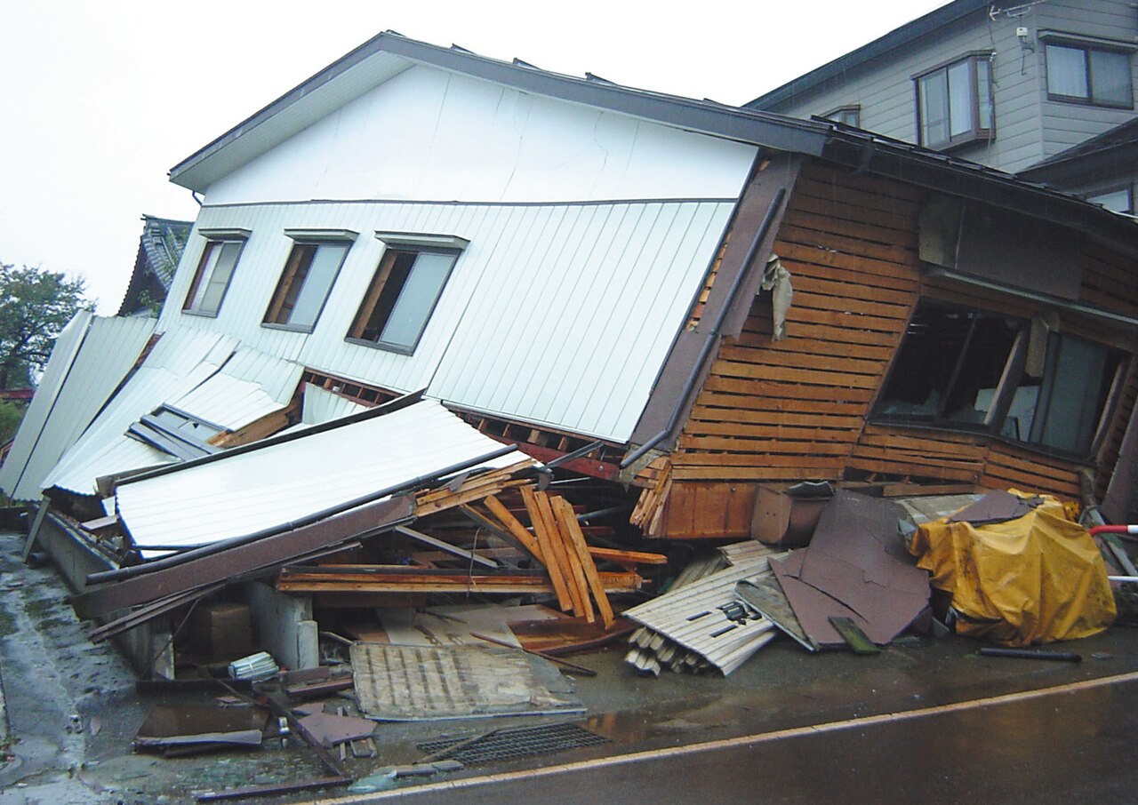 A house tilts and splinters after the earthquake strikes Niigata