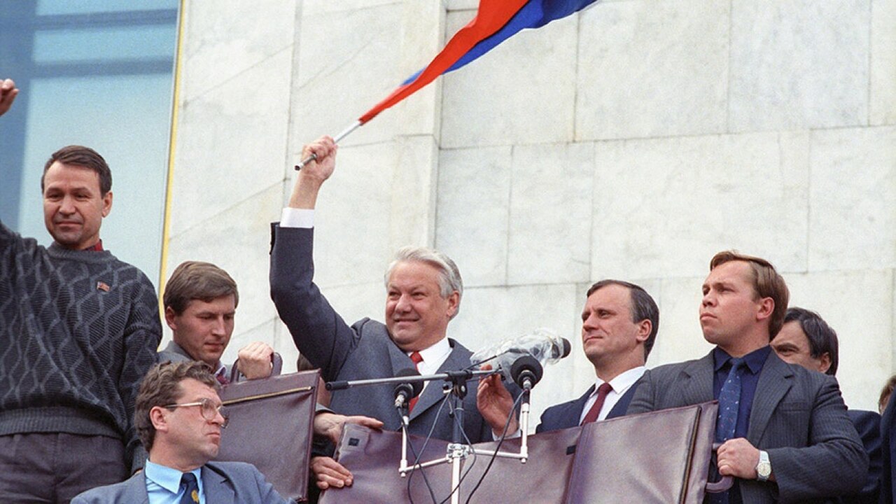 Yeltsin waves the Russian tricolour from a tank during the standoff