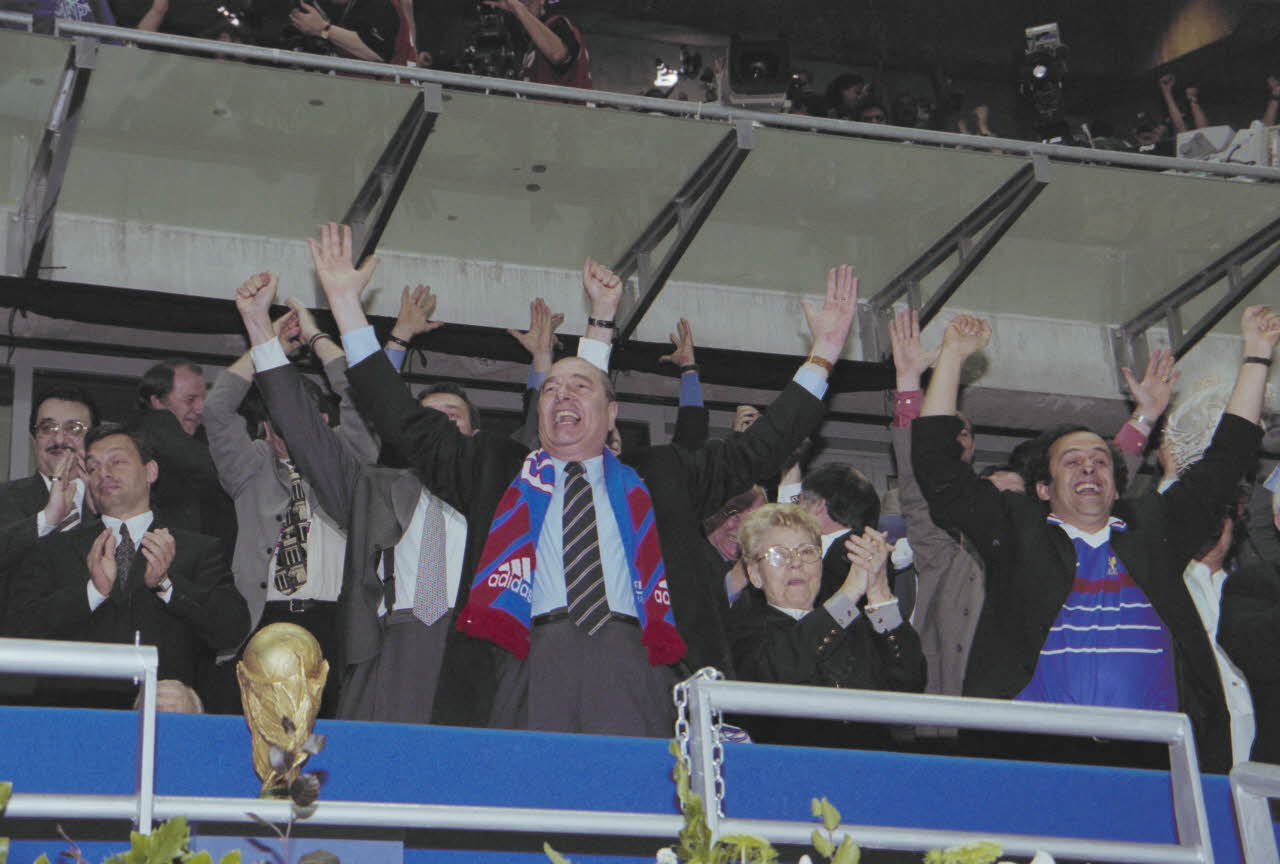 President Jacques Chirac celebrates France's historic 1998 World Cup victory over Brazil in Paris
