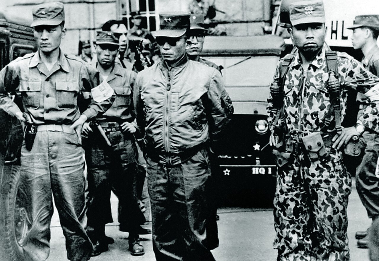 Kim Jae-gyu, centre, under arrest hours after the shooting