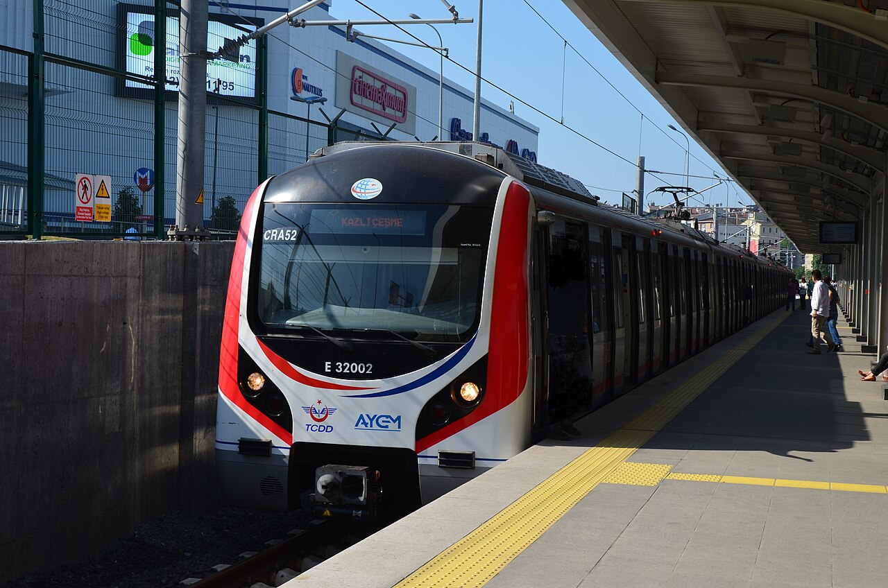 A Marmaray commuter train arrives at a station during the project's inaugural phase