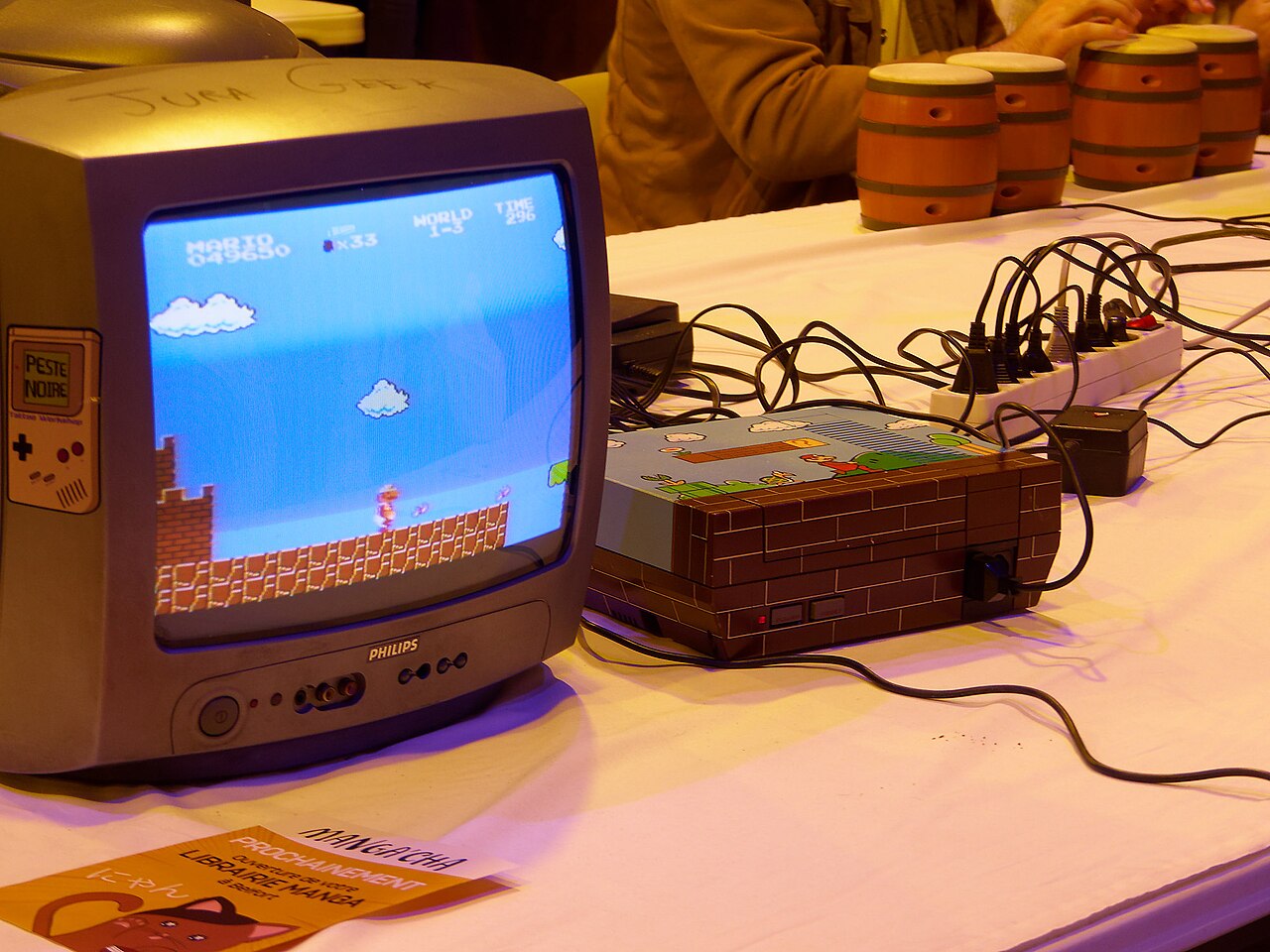 A player guides Mario across the television screen on the day of release