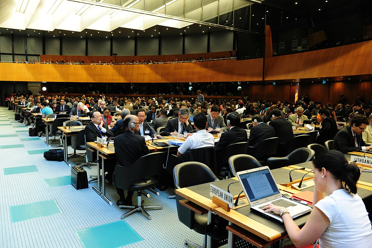 Delegates convene at a World Trade Organization meeting to discuss international trade policy