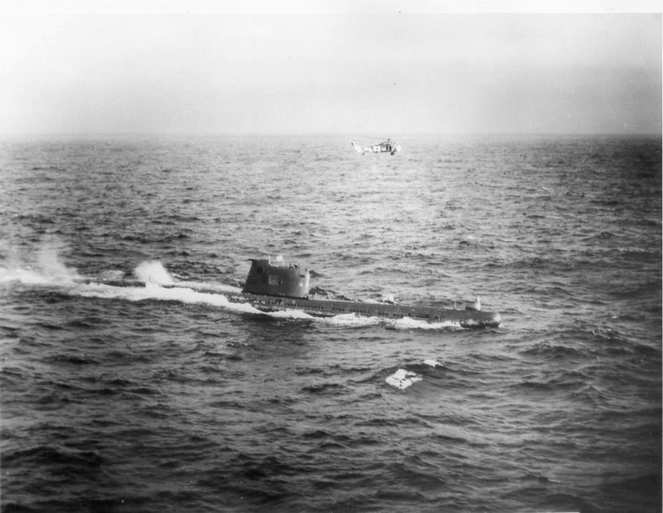 Soviet submarine surfaces near US helicopter during Cuban Missile Crisis