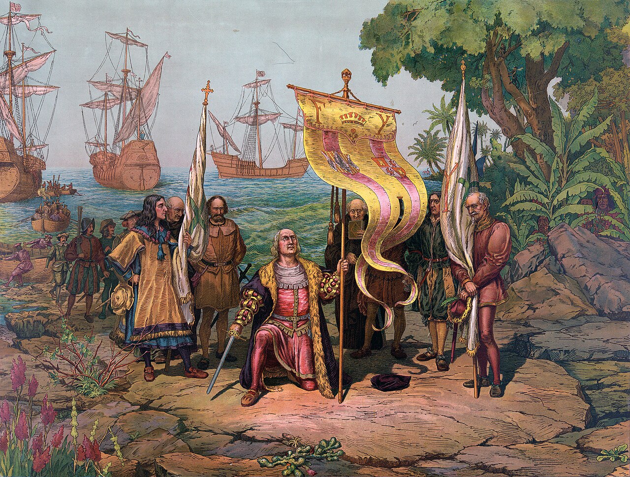 Columbus kneels on the shore as his ships stand offshore