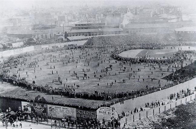 Thousands swarm the field after Boston clinches the first modern World Series