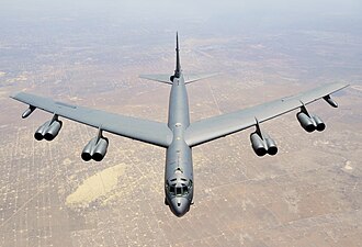 The Boeing B-52 Stratofortress takes flight, marking the debut of the iconic strategic bomber