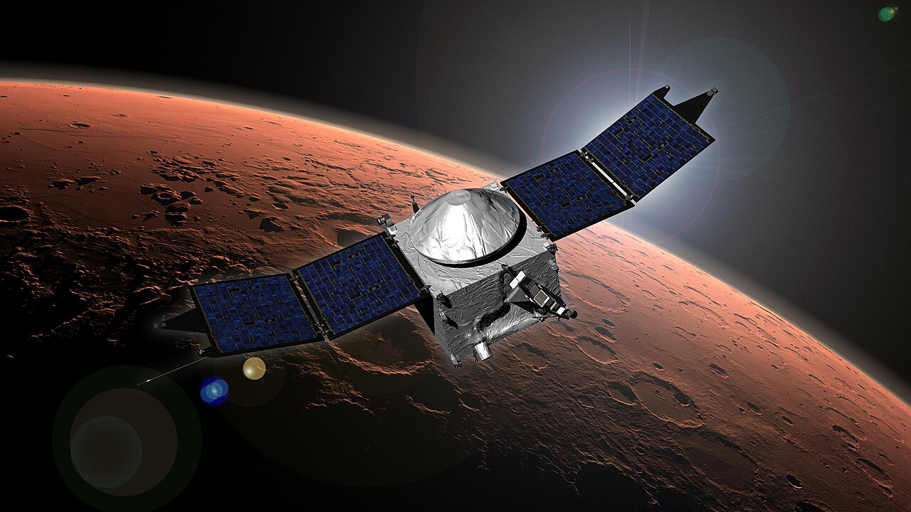 The MAVEN spacecraft fires its thrusters to enter orbit around Mars