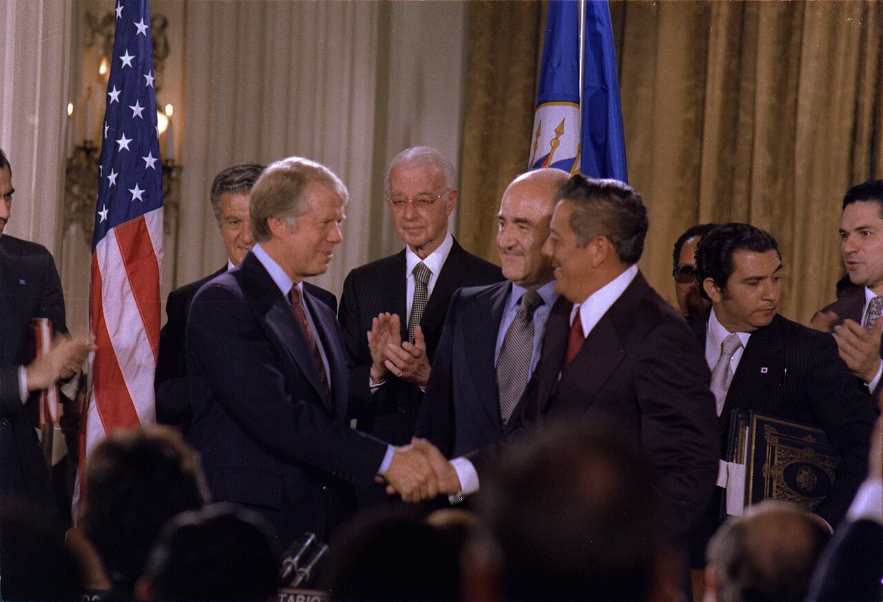 President Jimmy Carter and Omar Torrijos sign the treaties transferring the Panama Canal
