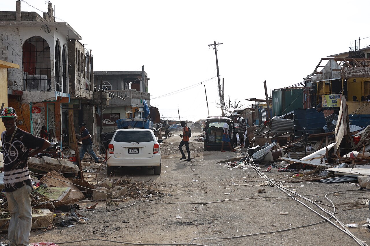 Residents walk through debris-filled streets after Hurricane Melissa struck Jamaica
