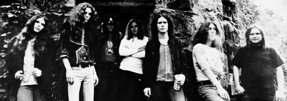 The band pose together in 1977, months before the crash