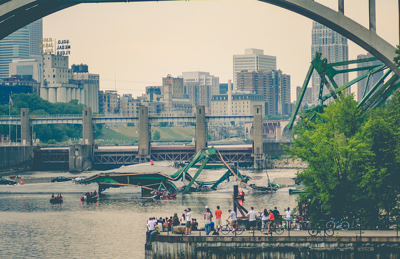 The I-35W bridge collapses into the Mississippi River, killing 13 and injuring 145 people