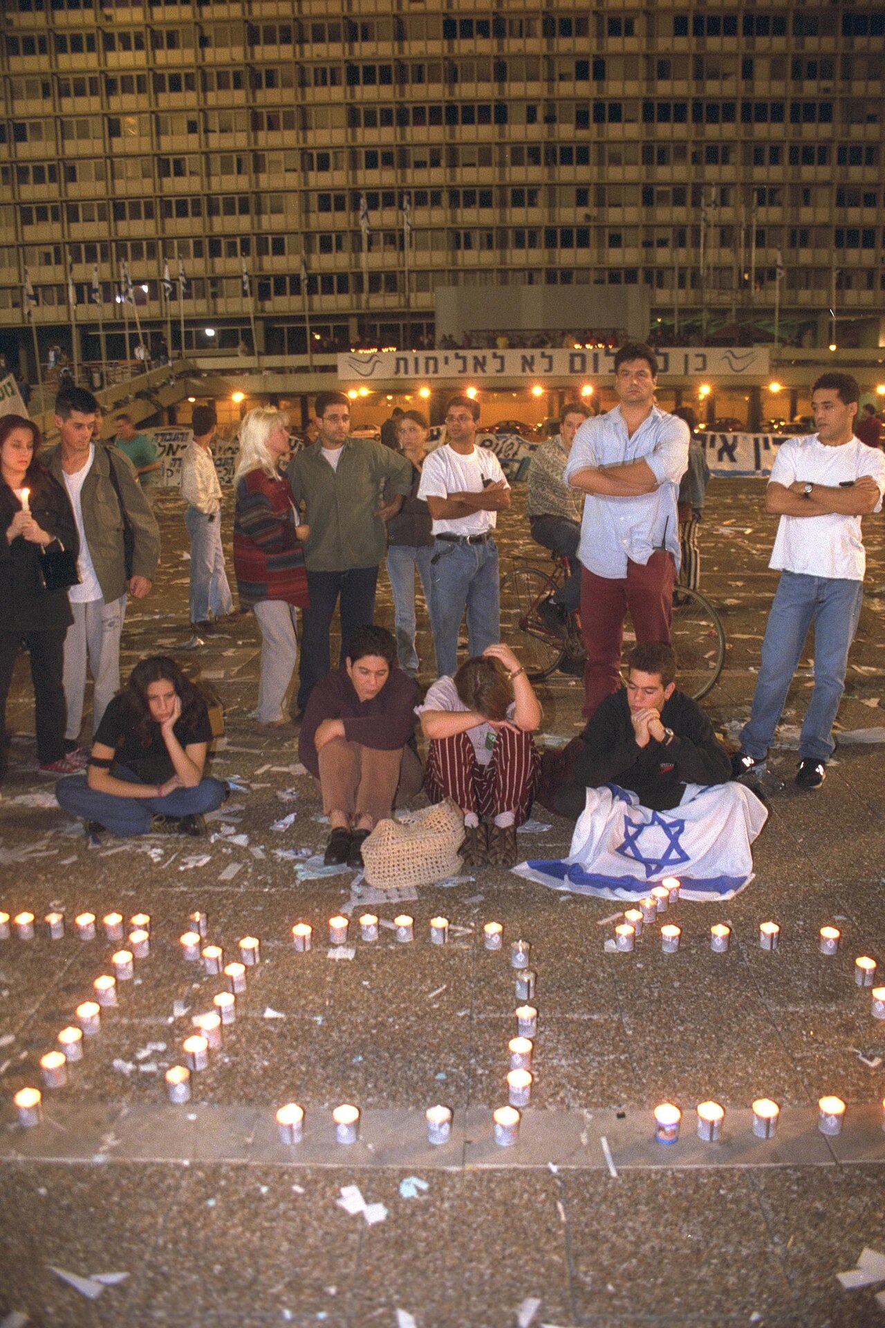 Mourners gather with candles at Kings of Israel Square after the shooting