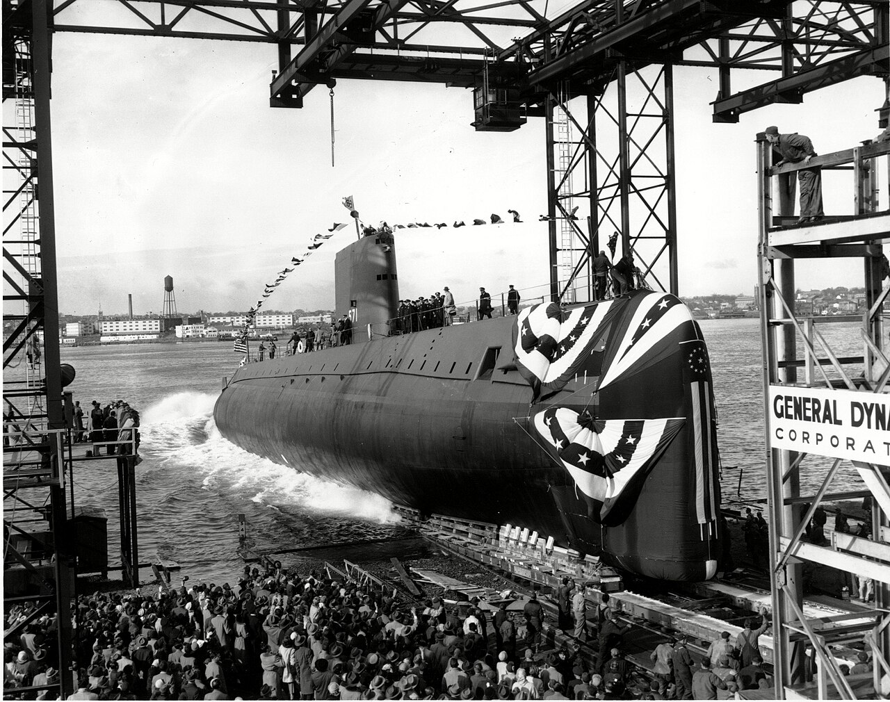 The nuclear submarine slides into the water at the commissioning ceremony