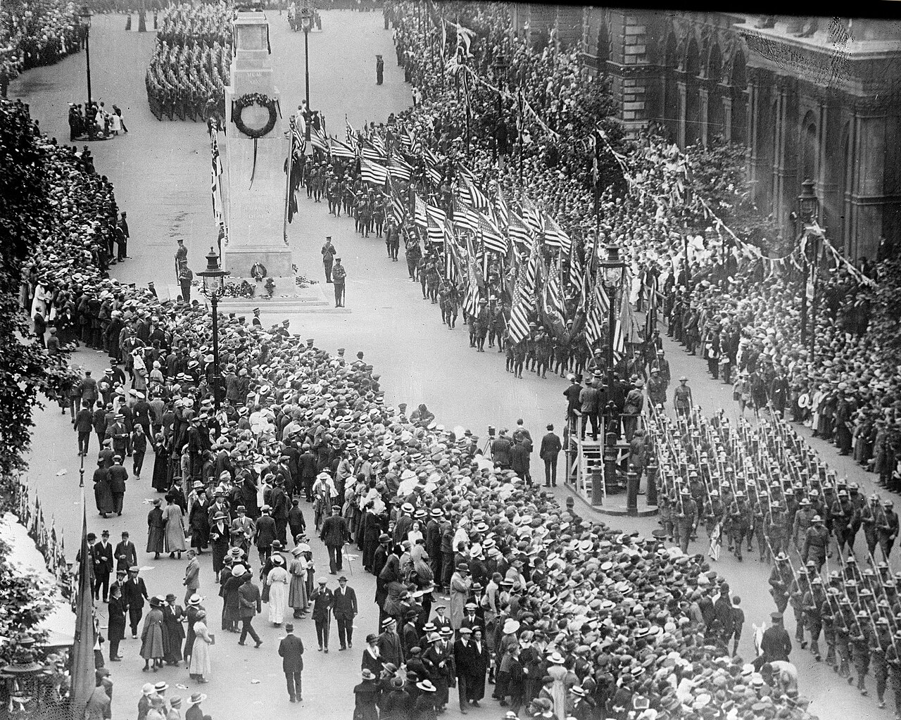 Troops march past the Cenotaph as crowds line Whitehall