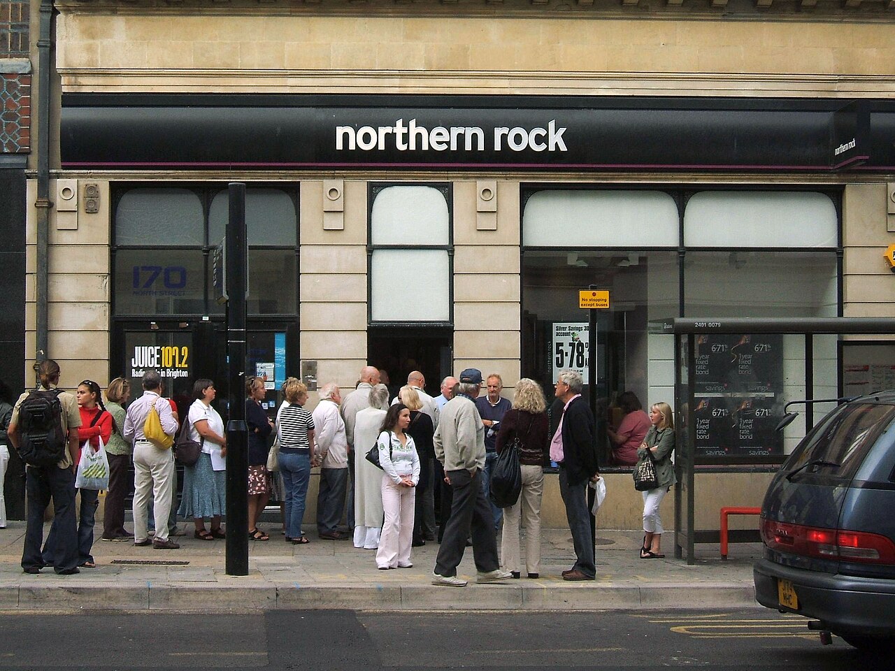 Customers queue outside a Northern Rock branch in September 2007