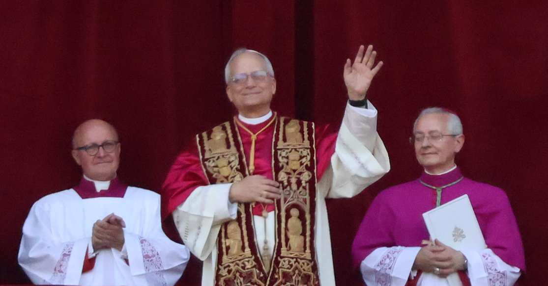 Pope Leo XIV, the first American-born pontiff, greets the faithful from the Vatican balcony
