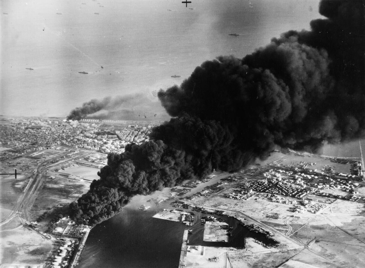 Smoke rises from oil tanks hit by British and French bombers at Port Said