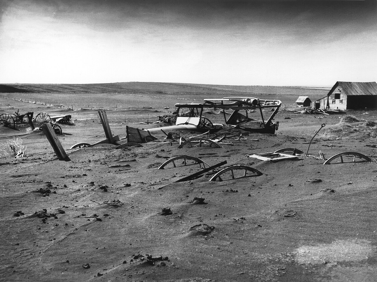 A farmstead buried in topsoil during the devastating Dust Bowl of the 1930s