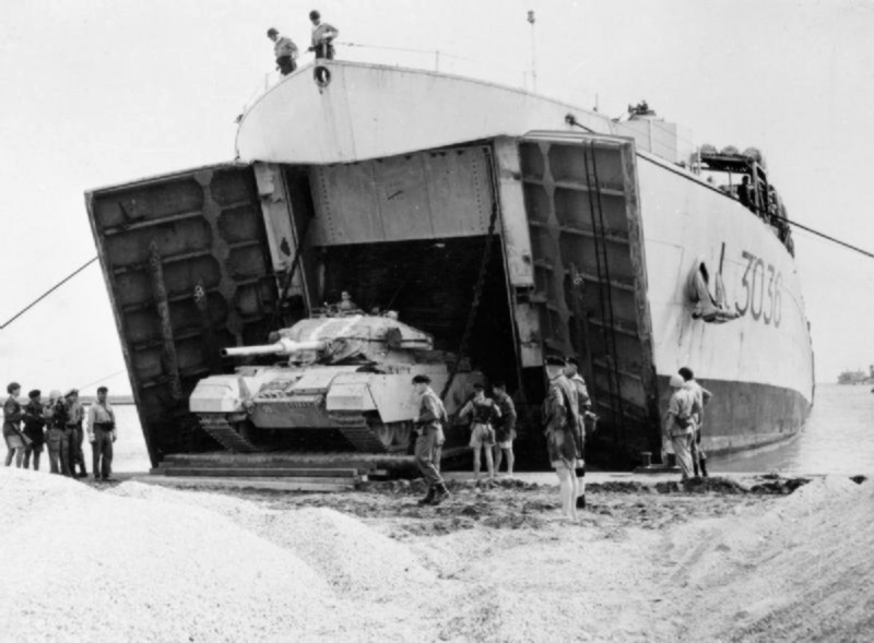 An Israeli Centurion tank comes ashore from a landing craft on the Sinai coast