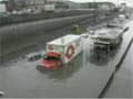 Vehicles stranded on a flooded Montreal expressway following record-breaking rainfall