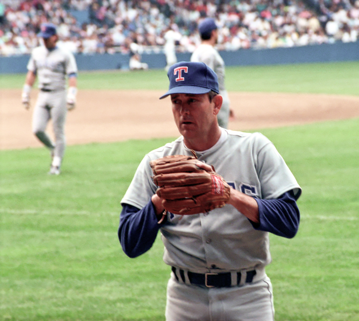The pitcher winds up for the record-breaking strikeout