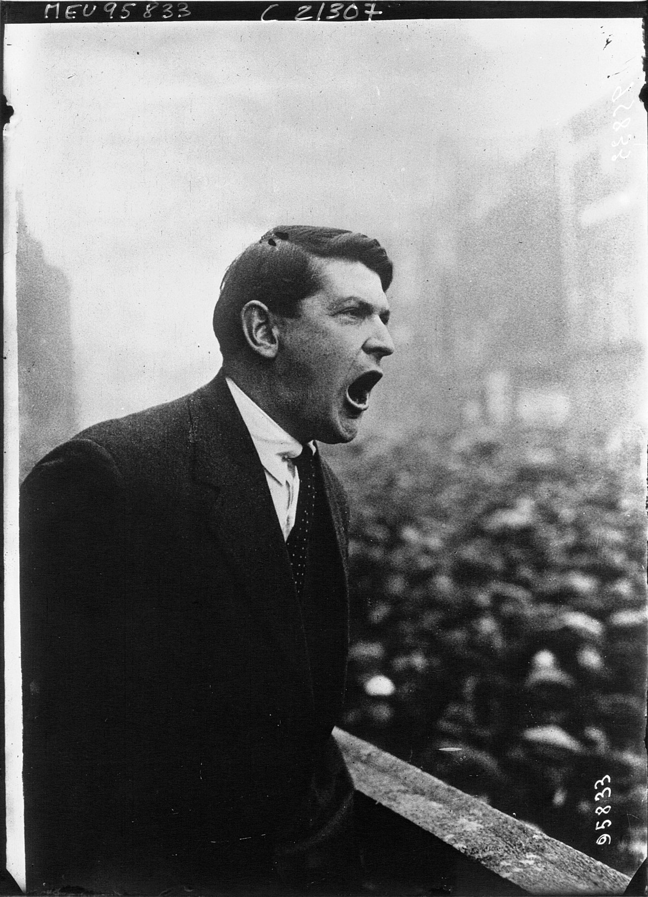 Michael Collins addresses a rally from a platform